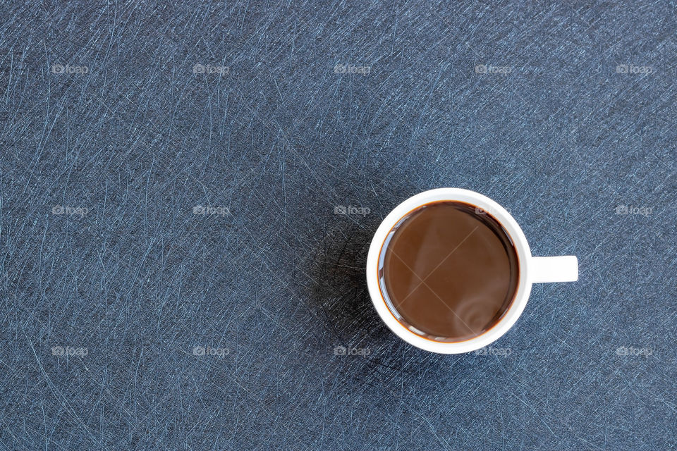 Top view to one mug with coffee. Copy paste.