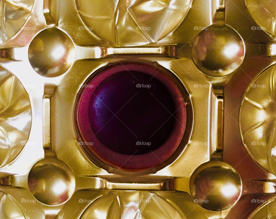 Chocolate candy in gold wrapper