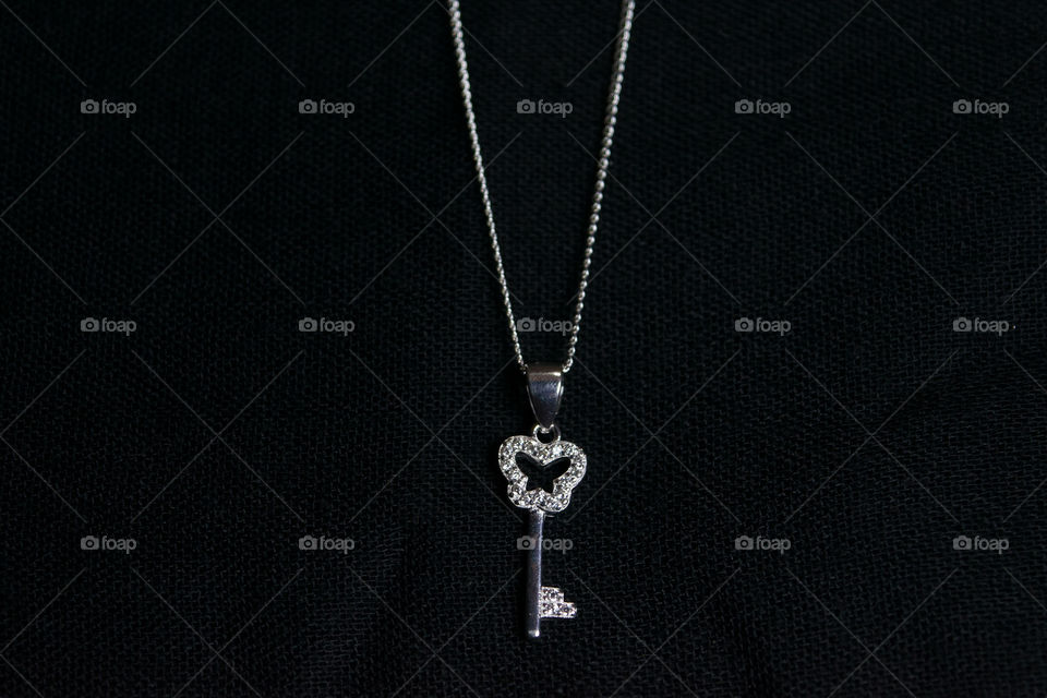 Silver necklace with key pendant