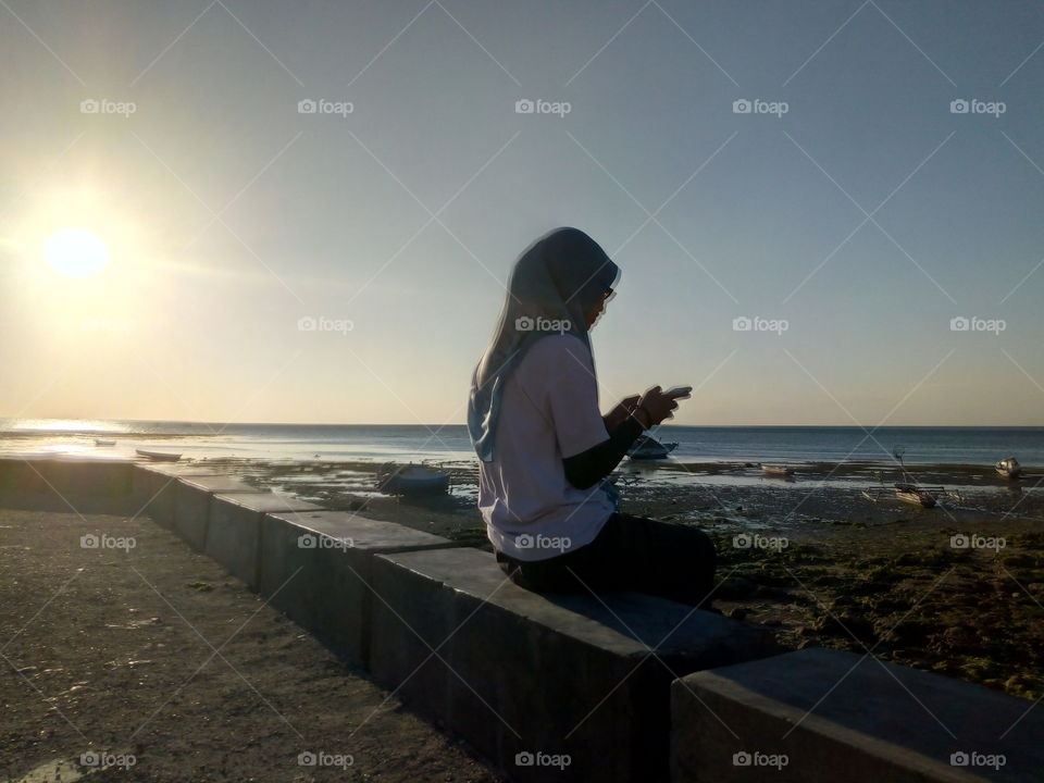 Lonely girl at the beach