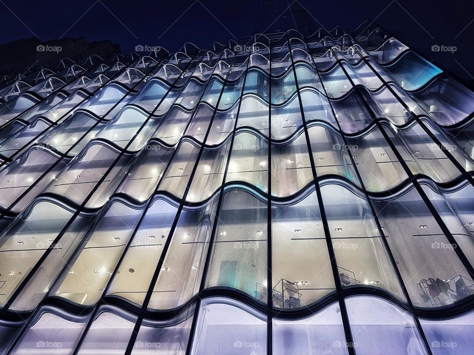 Undulating glass windows on an office building 