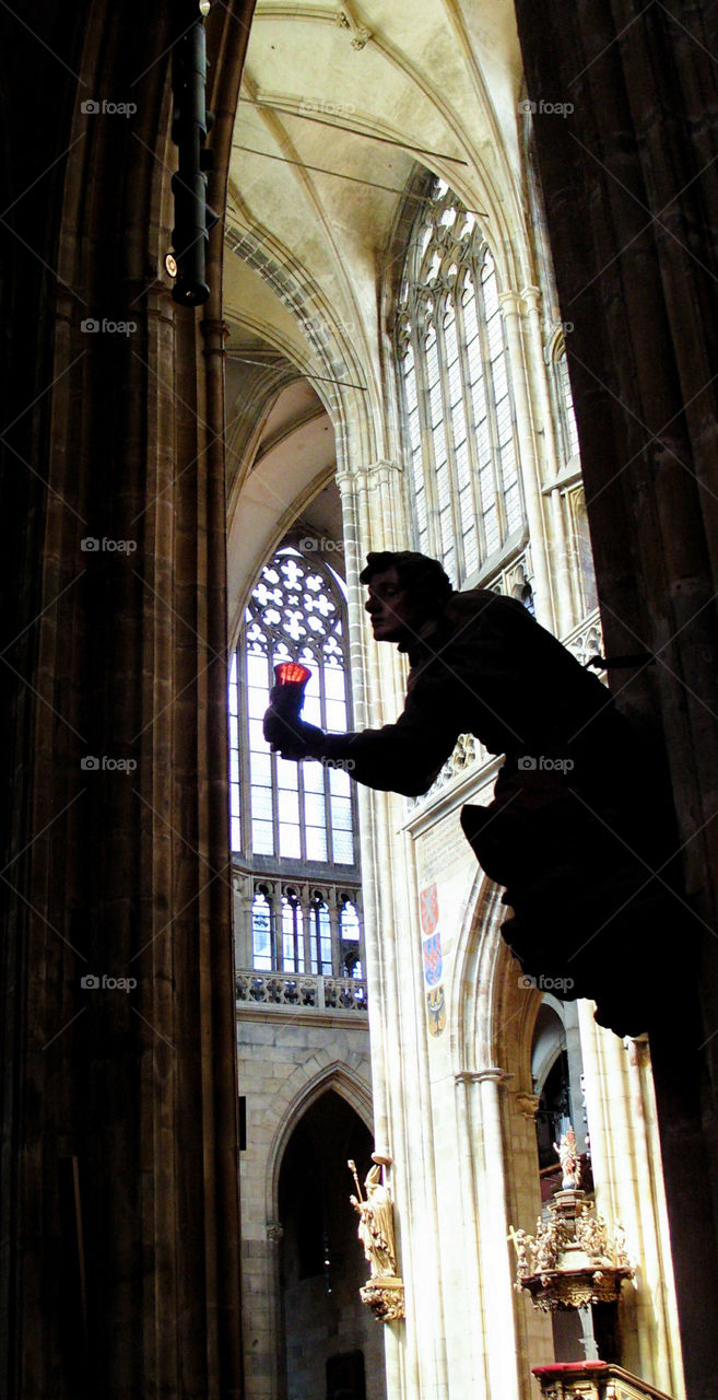 A statue inside a cathedral in Prague