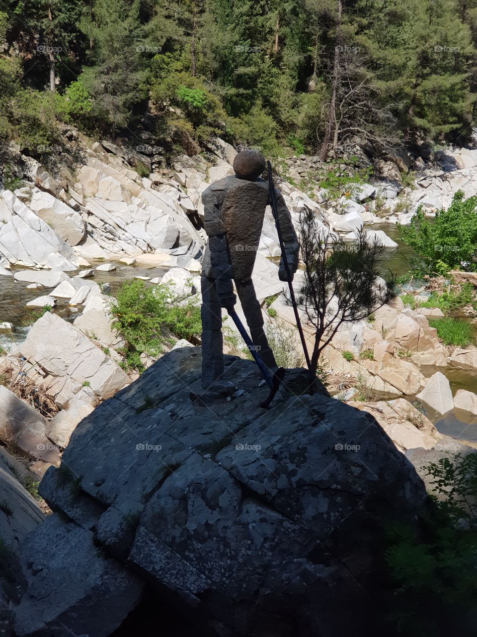 A weird statue on the rocks
