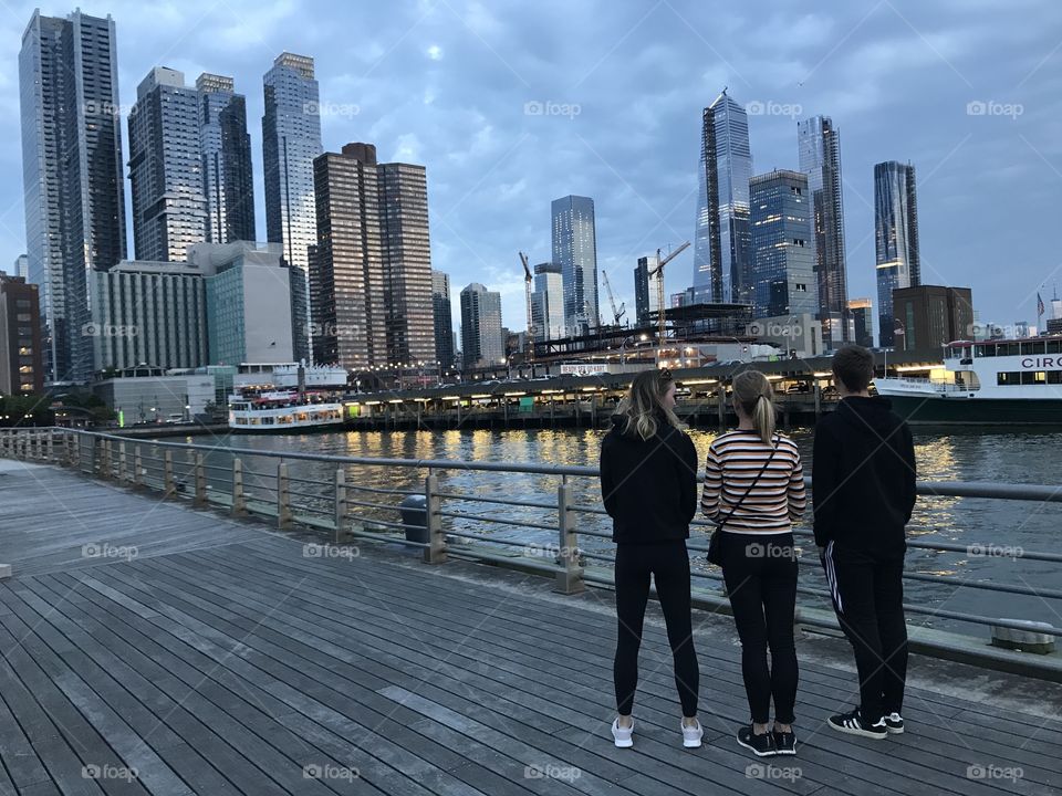 Family view New York Skyline from Hudson River Park Pier 84