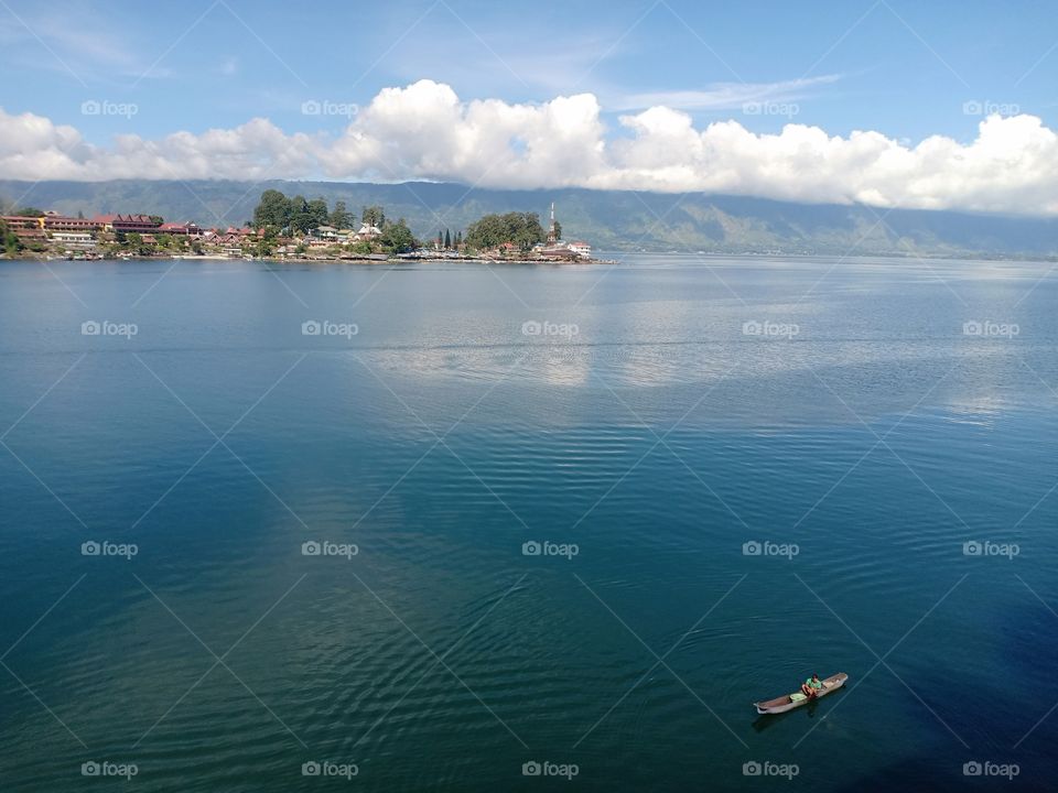 Lake Toba with beauty mistycal. Wind, Rain touch the water. Lake as a livelihood.