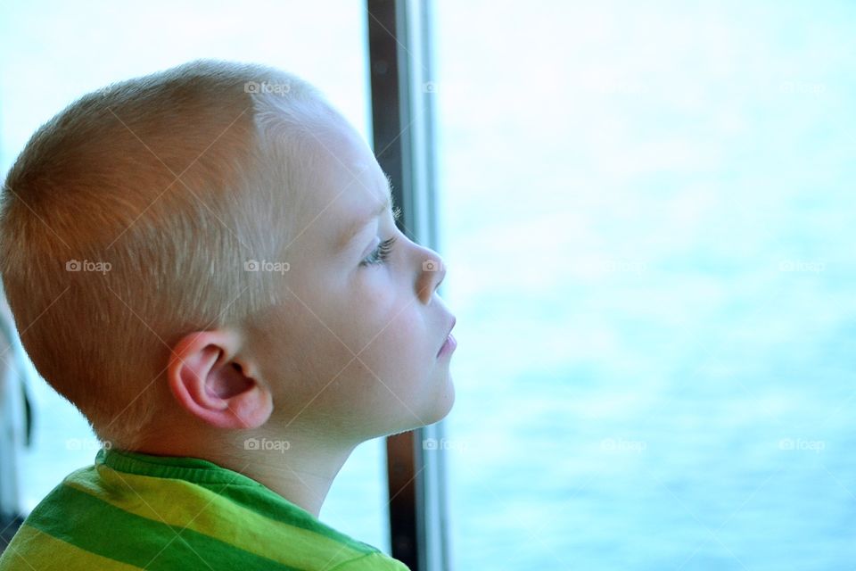 Boy looks out the window