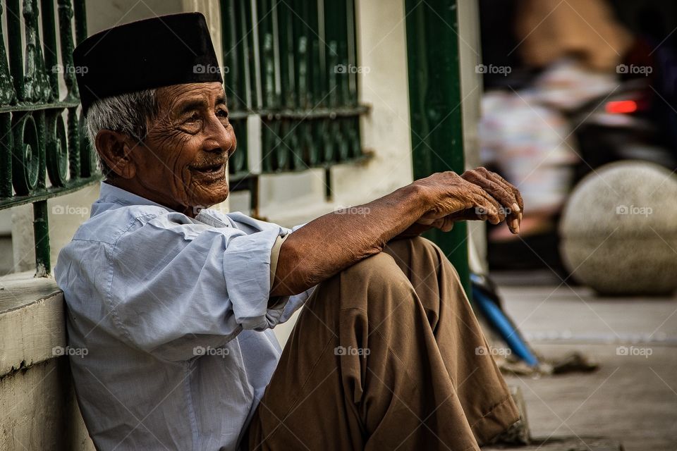 An Old Man I met in Malioboro Street Yogyakarta. He was smiling at some teenagers around there.