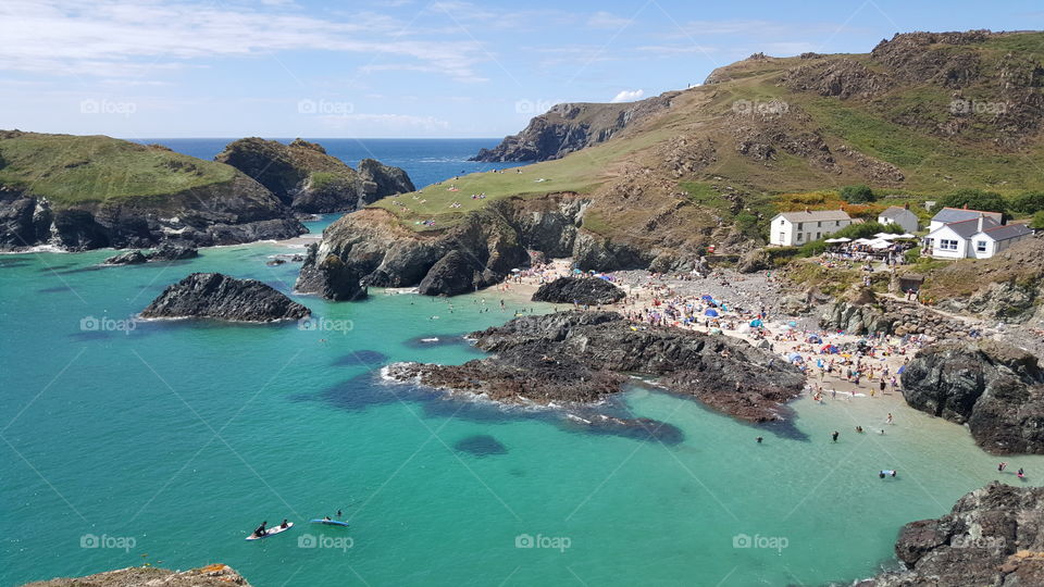 Distant view of people enjoying at beach