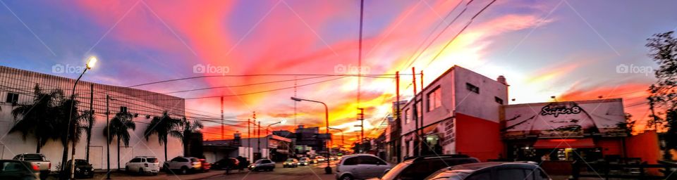 Panorama of a beautiful sunset overlooking the rush hour traffic.