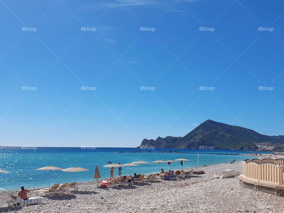 Beach#summer#sea#rocks#parasols