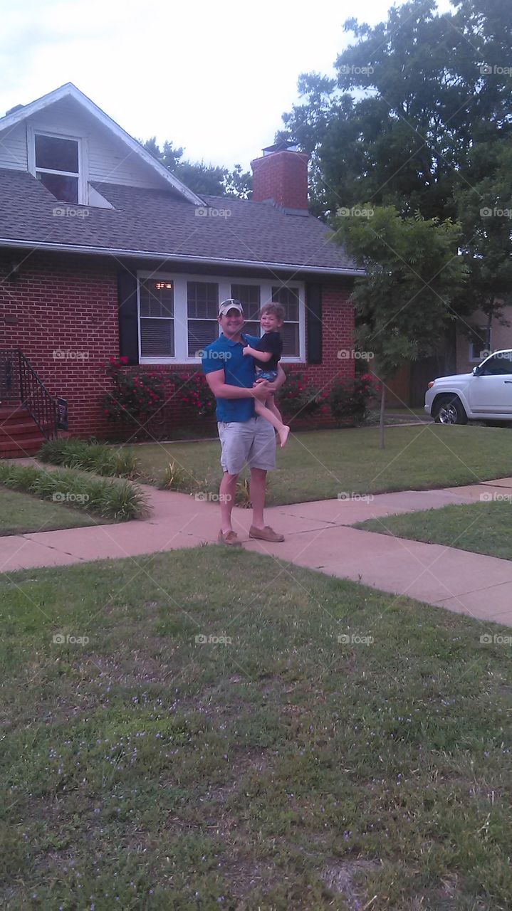 father and son. i asked this man if i could take and sell his picture