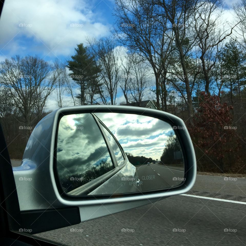 Leave The Storm Behind-Sunny Day Ahead

Looking in my rear view mirror I see the bad weather I'm leaving behind. But as I drive I can see the sun shining through the clouds up ahead of me!