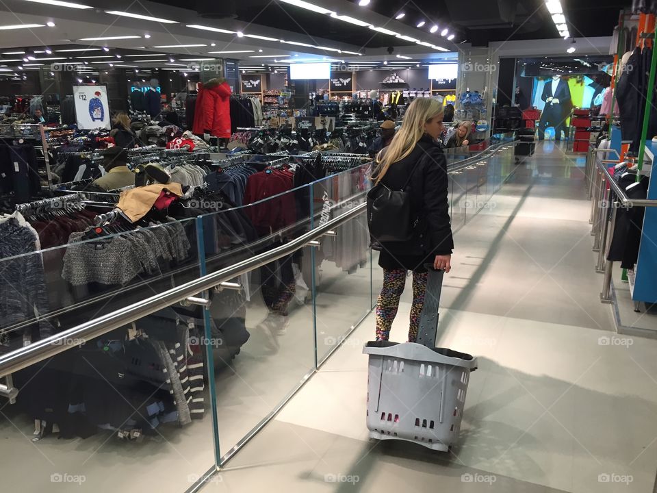 Woman shopping in a local Shopping center Primark) in London. 