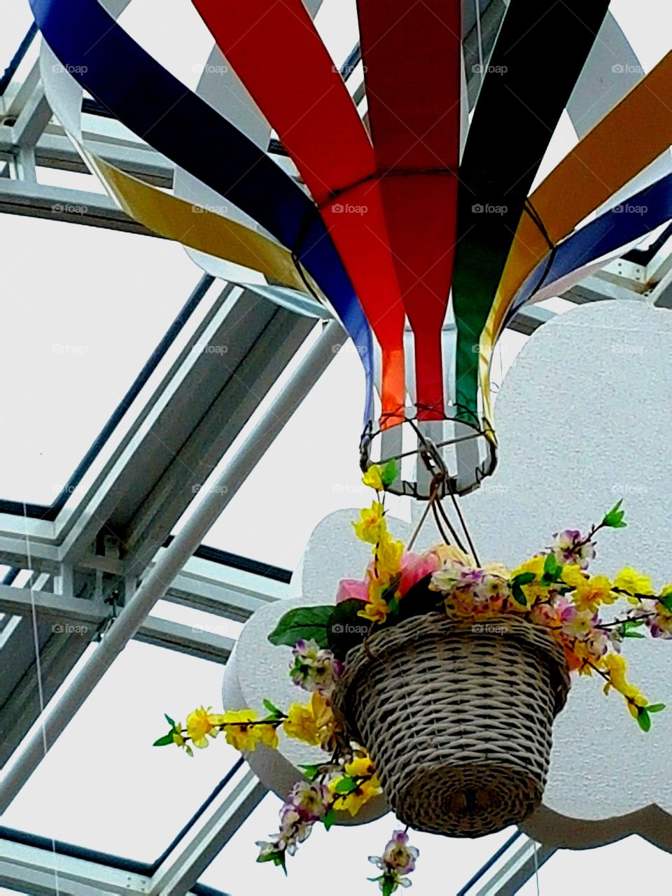 basket with flowers under the roof