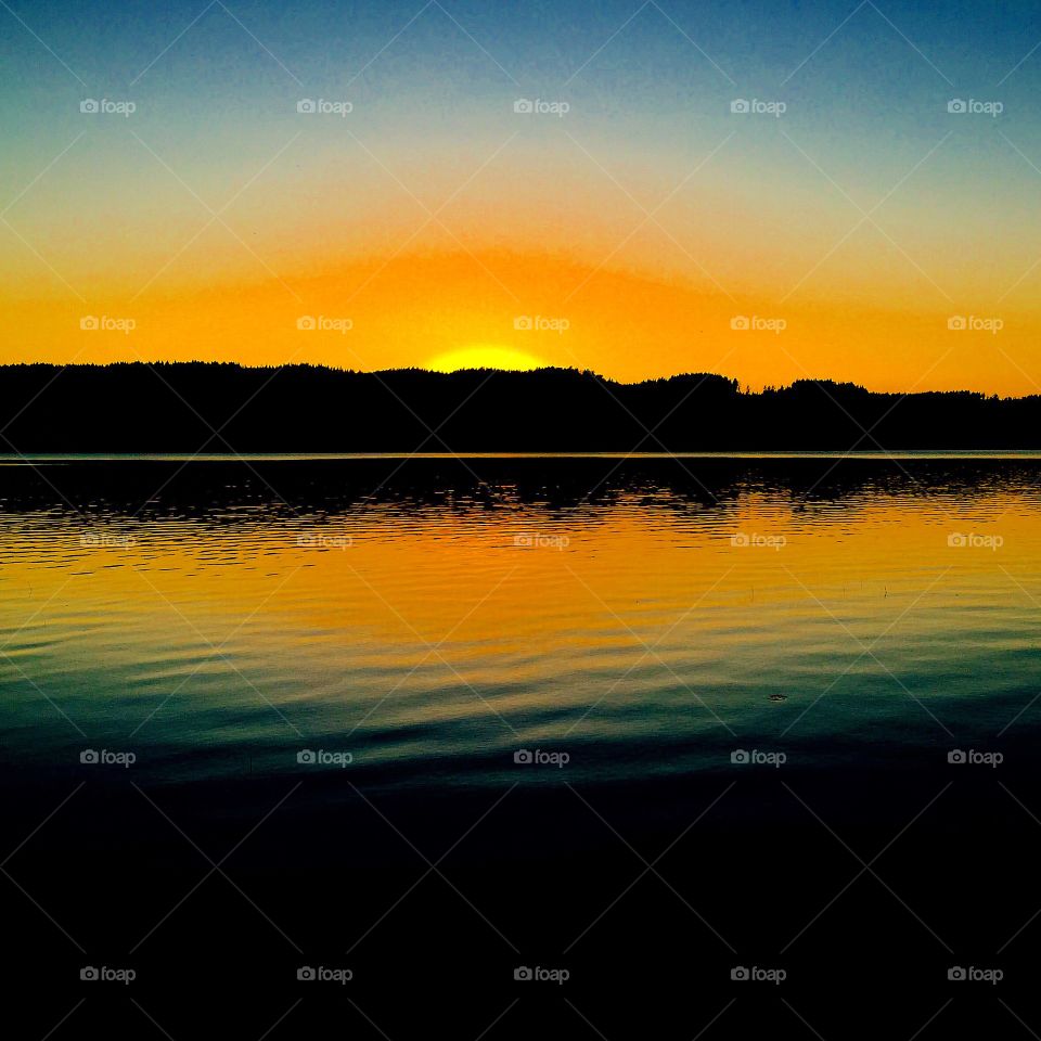 Sunset. Evening by the lake
