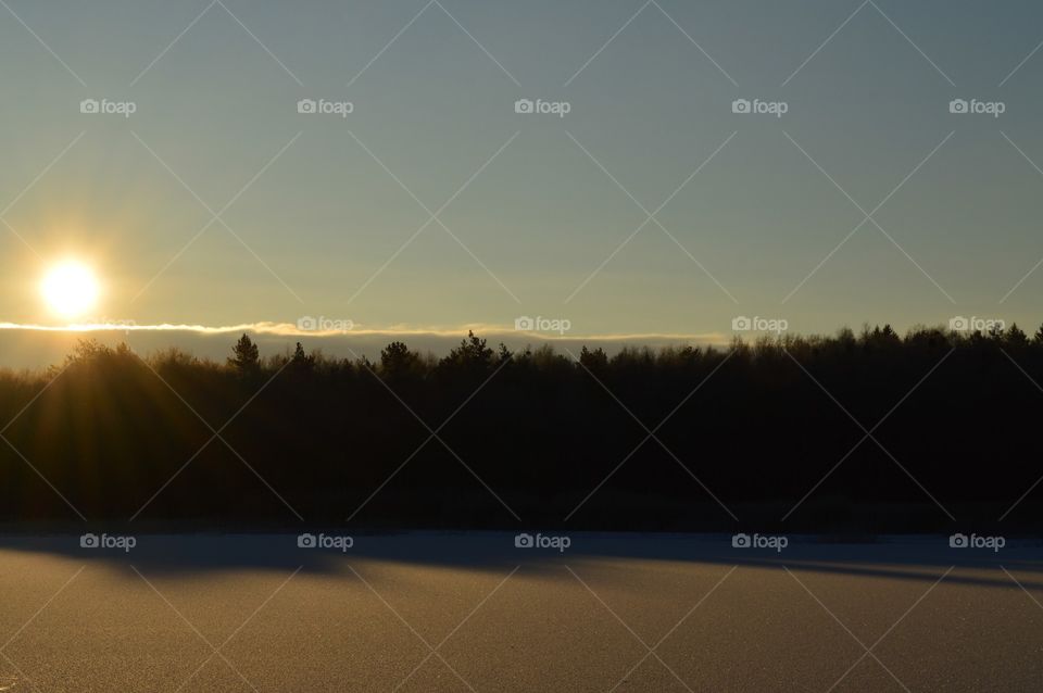 sunrise on the lake in winter