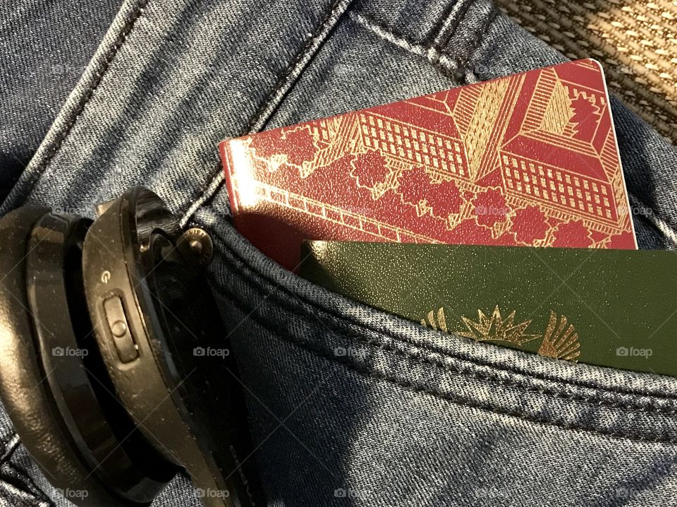 Travel clothing with passport and headphones