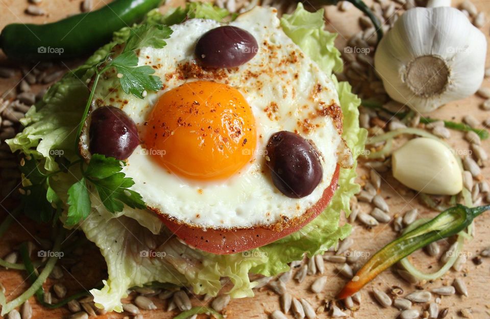 Round shape of burger with egg yolk