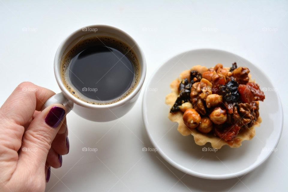 cup of coffee in the hand and cake autumn time, autumn colours, good morning