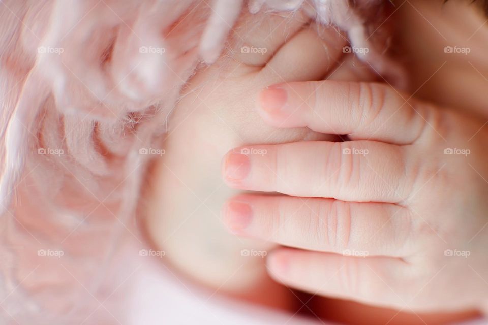 Macro photography of newborn hands