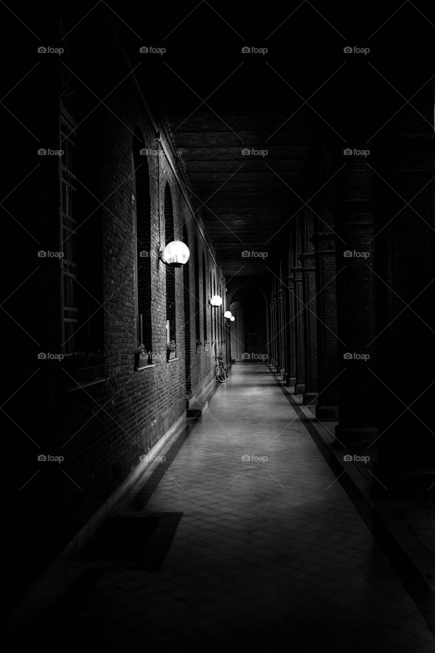 dark street lit by lanterns