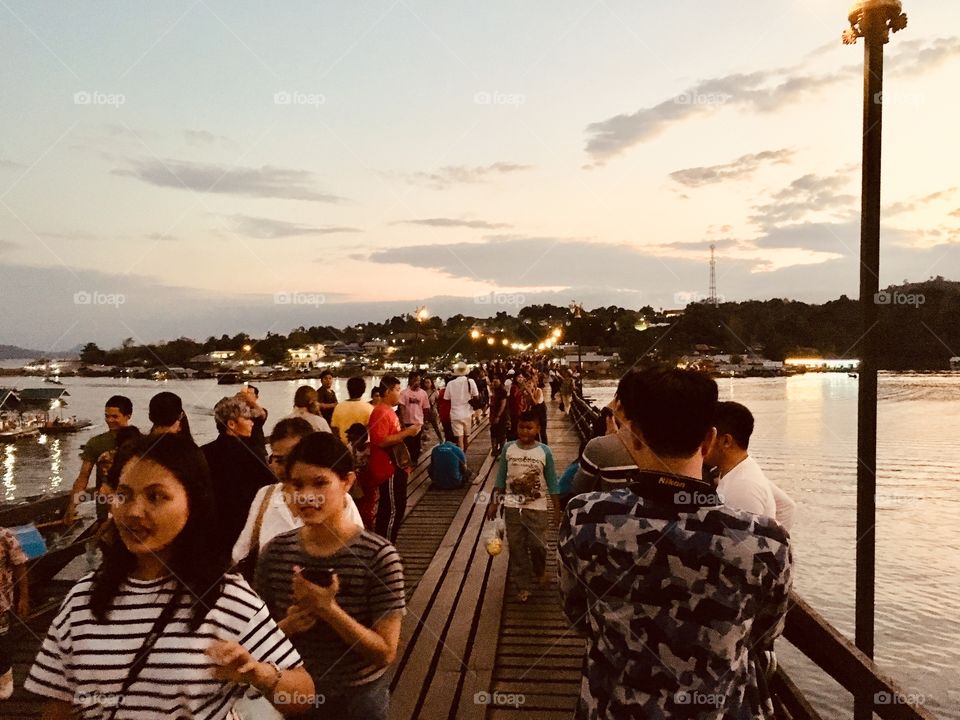 People on Mon bridge