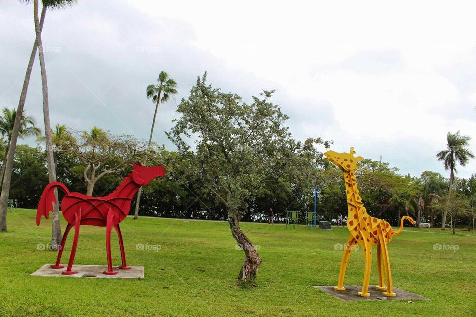 fake giraffes at park