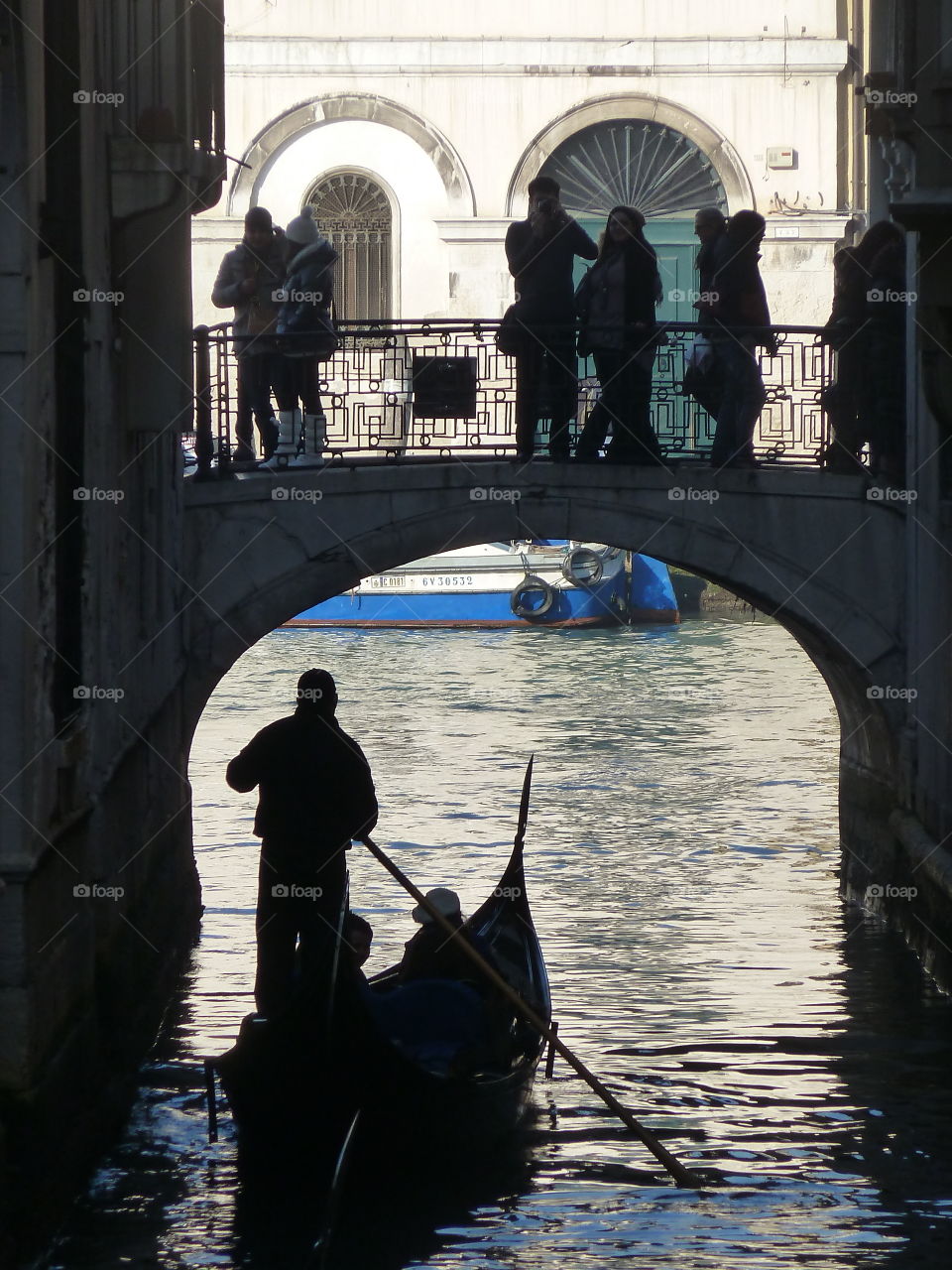 gondola under a bridge in Venice