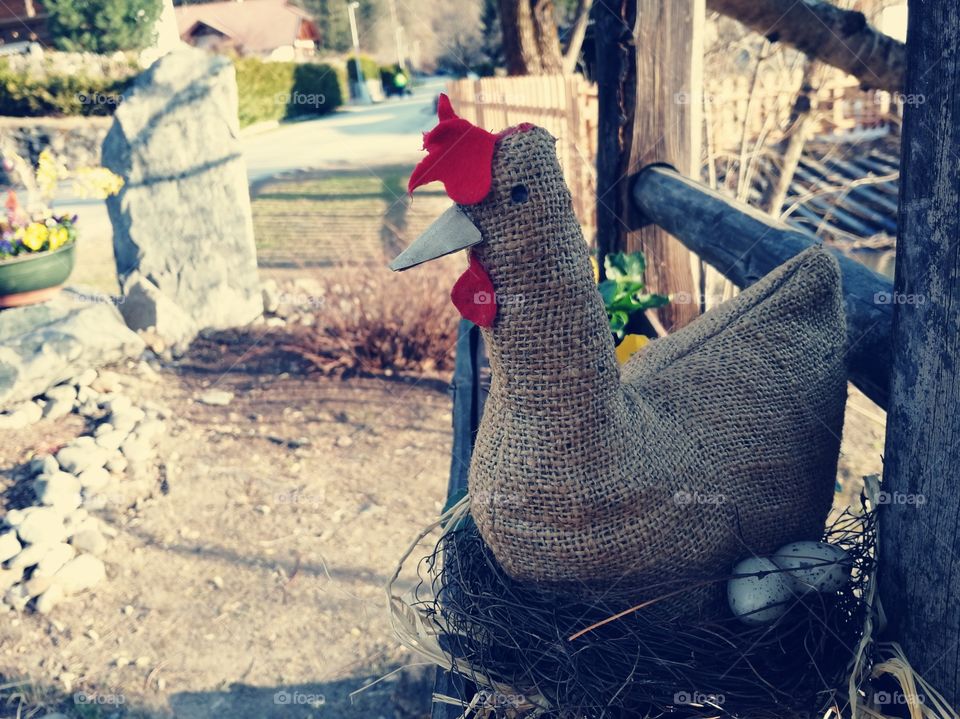 Easter chicken with eggs as decorative element in an open air