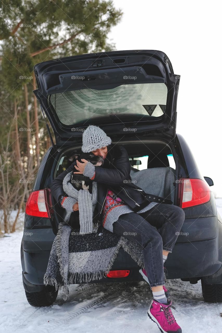 Woman with dog in car 