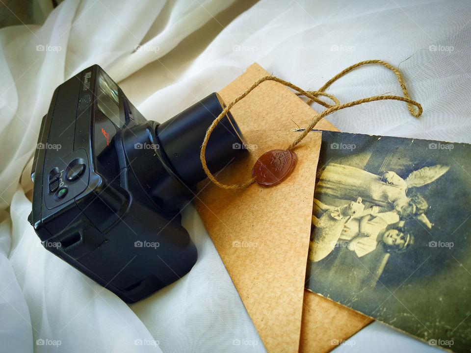 Camera.  The envelope.  Old photo