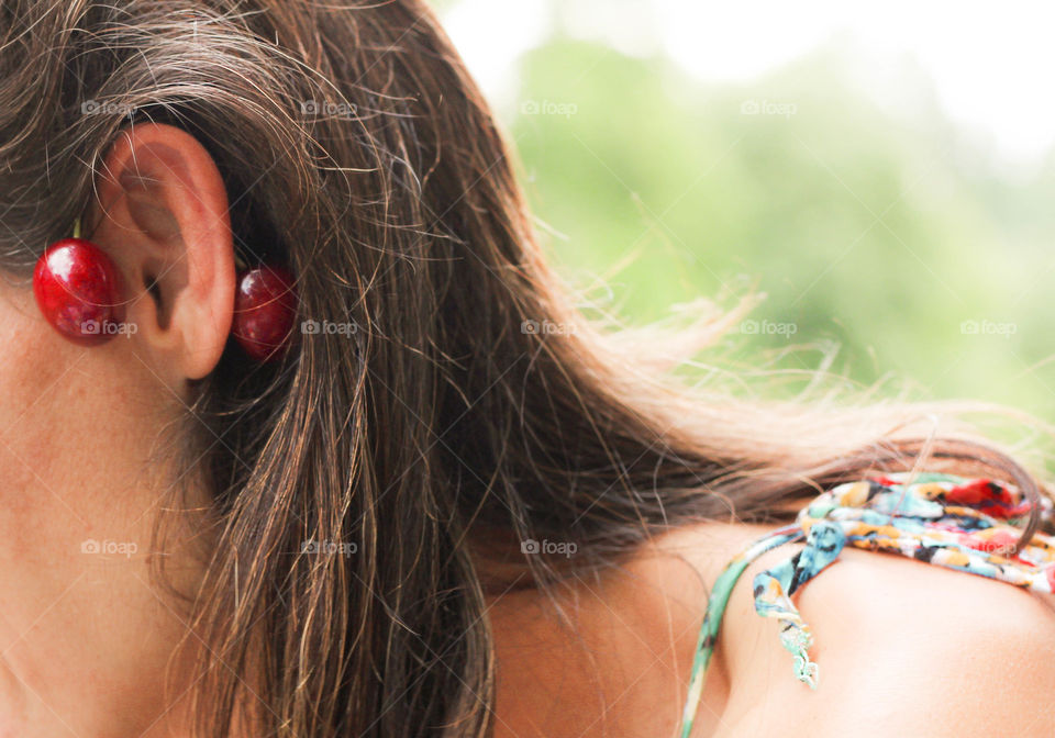 Woman's earring of cherries, summer mood
