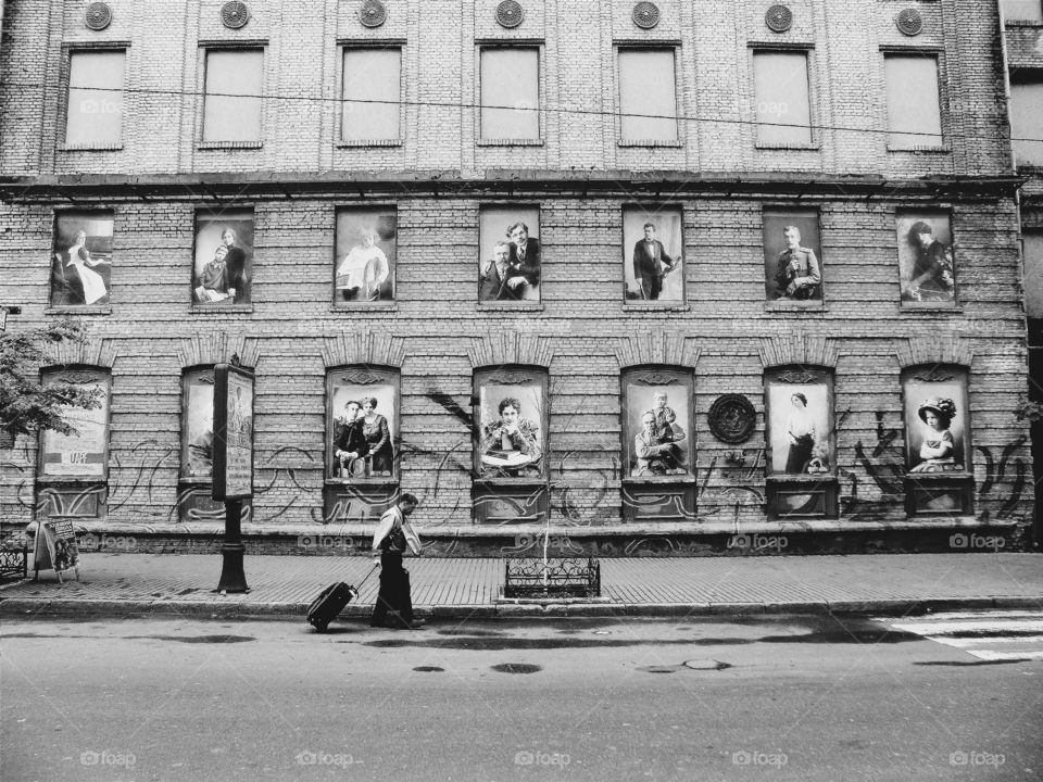 man with a suitcase on a city street