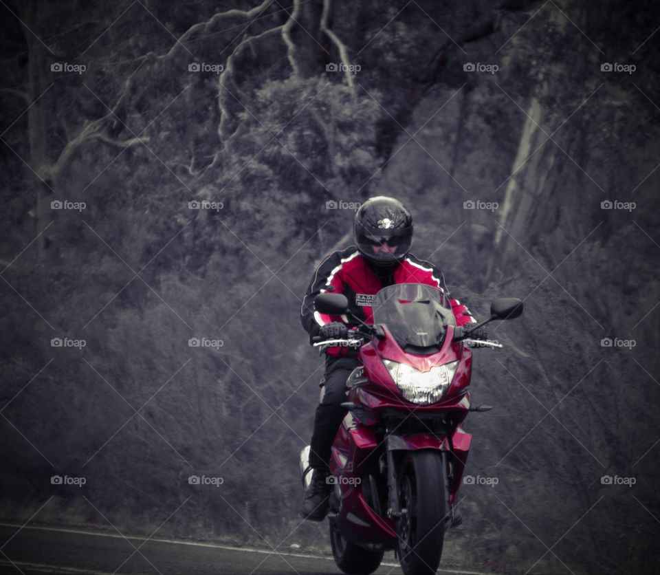 Riding a red motorcycle in the Australian country