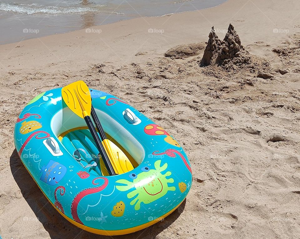 Summer on the beach. Sand castle.