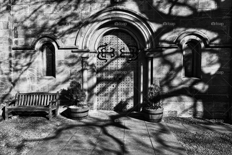 Church door shadows monochrome