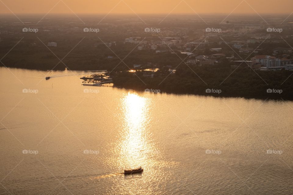 Nice scene of sun light reflect on Chao Phraya River , Photo view from city tower of Samut Prakan province Thailand 