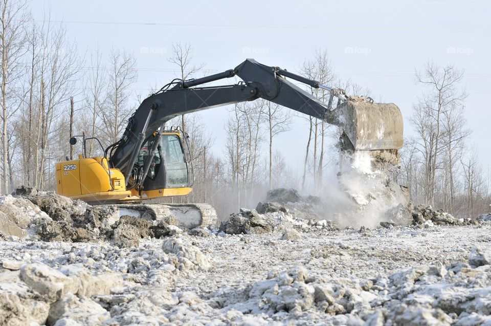 Excavator on winter worksite
