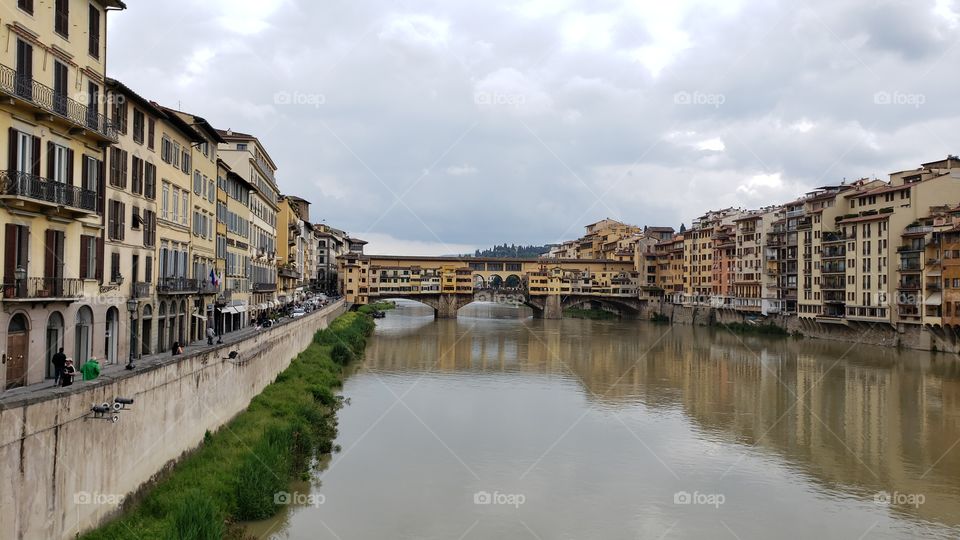 The famous Ponte Vecchio medieval stone bridge over Arno river in Florence, Italy, Europe