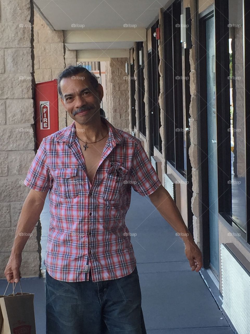 Deaf Hispanic Male in Florida. Originally from Guatemala--Fredy is deaf. He is entering Days Inn in Davenport, FL. August 2015.