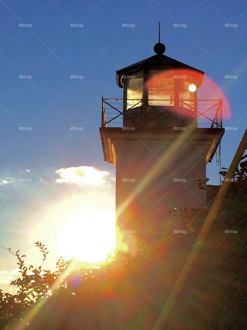 Lighthouse at Sunset. During that time of day when the sun baths everything in gold, the lighthouse glowed.