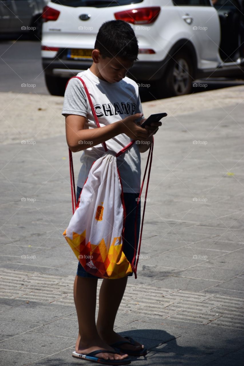 A kid using a mobile device 