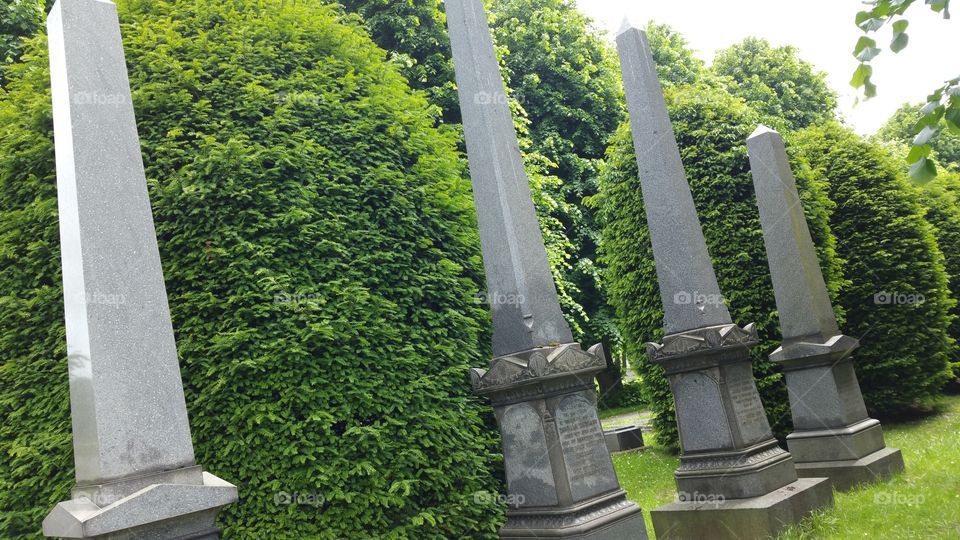 English cemetery
100 + years old graves
Some people think graveyard and cemetery mean the same, but, if we want to be a little nitpicky, we should say that graveyard is a type of cemetery, but a cemetery is usually not a graveyard. To understand the difference, we need a little bit of history.
From about the 7th century, the process of burial was firmly in the hands of the Church (meaning the organization), and burying the dead was only allowed on the lands near a church (now referring to the building), the so-called churchyard. The part of the churchyard used for burial is called graveyard, an example of which you can see in the picture.
As the population of Europe started to grow, the capacity of graveyards was no longer sufficient (the population of modern Europe is almost 40 times higher than it was in the 7th century). By the end of the 18th century, the unsustainability of church burials became apparent, and completely new places, independent of graveyards, were devised—and these were called cemeteries.
The etymology of the two words is also quite intriguing. The origin of "graveyard" is rather obvious; it is a yard filled with graves. However, you might be surprised to hear that "grave" comes from Proto-Germanic *graban, meaning "to dig", and is unrelated to "gravel".
Of course, the word "cemetery" did not appear out of the blue when graveyards started to burst at the seams. It comes from Old French cimetiere, which meant, well, graveyard. Nevertheless, the French word originally comes from Greek koimeterion, meaning "a sleeping place". Isn't that poetic?