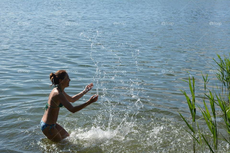 woman in the water lake summer heat, summer vacation