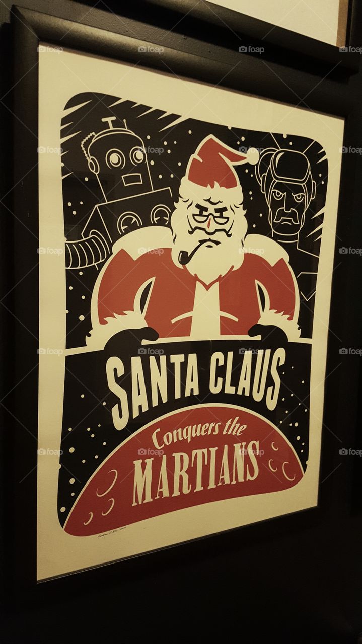 Santa Claus Conquers the Martians announces a kitschy vintage movie poster.