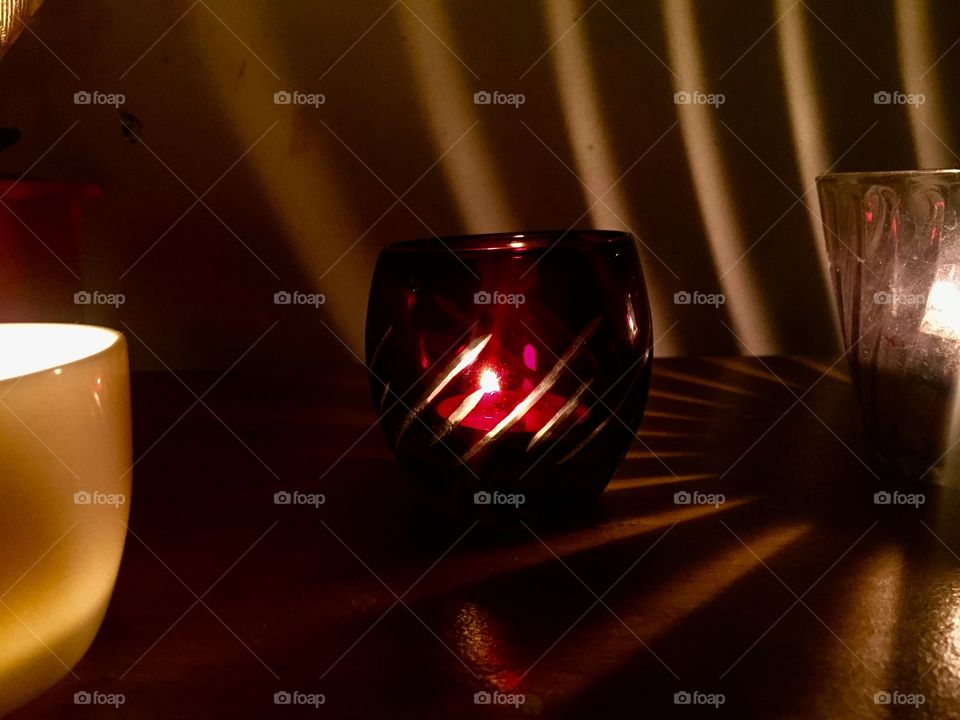 Look at how a single candle can both defy and define the darkness.