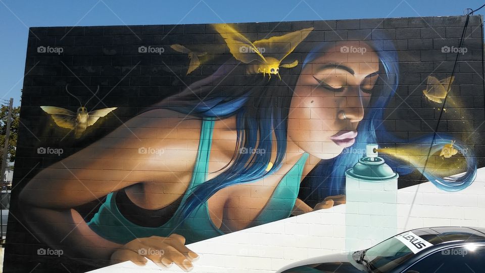 building wall painting, moths drawn to a beautiful Flame