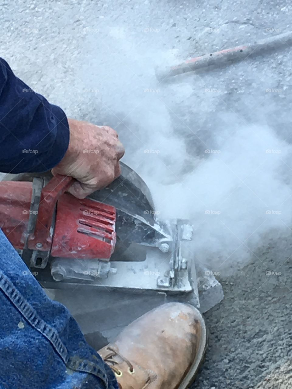 Cutting cement brick for step work. Tool made lots of dust & noise! Diamond circular blade.