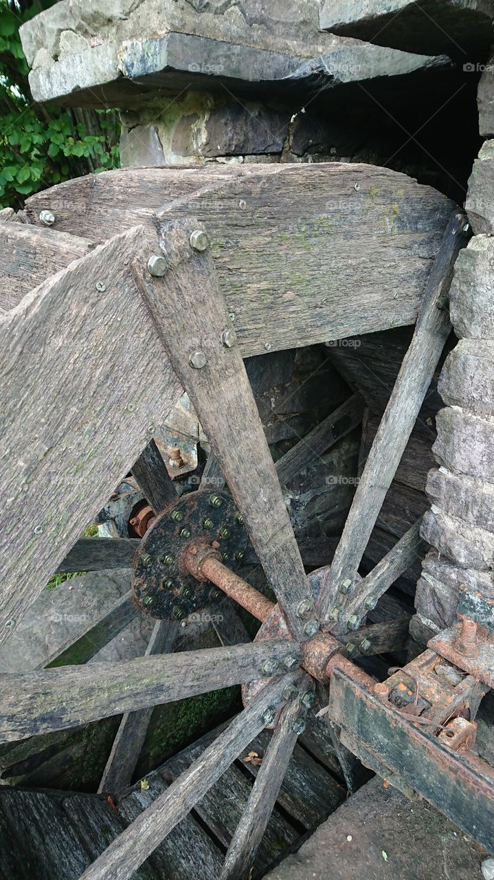 Old wooden water mill wheel