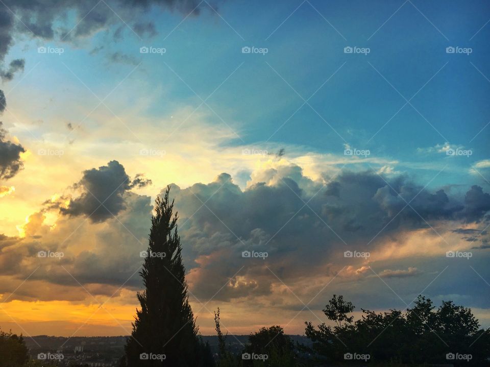 Cloudy sky over town at dusk